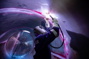 Industrial welding inside of an enclosed space
